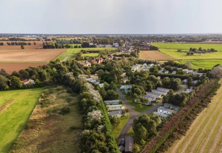 Drone view of Silverhill Holiday Park surrounded by woodland and open countryside