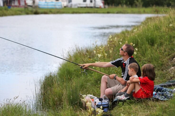 Anglers fishing at the trout lake and mixed coarse fishery adjacent to Hall More Caravan Park.